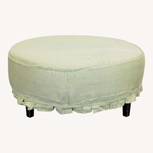 Used Slipcovered Ottoman with Wood Feet	 for sale on AptDeco
