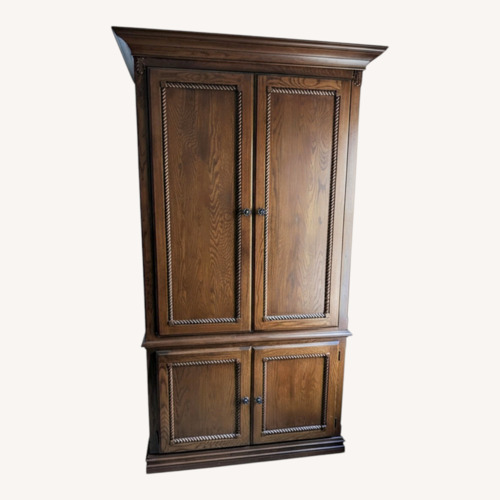 Used Dark Brown Wood Armoire for sale on AptDeco