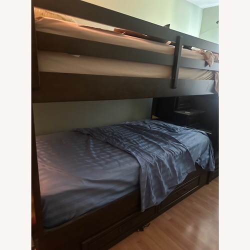 Used Raymour & Flanigan Dark Brown Wood Bunk Bed for sale on AptDeco