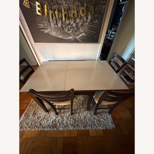 Used Italian Extendable Dining Table + 4 Chairs for sale on AptDeco