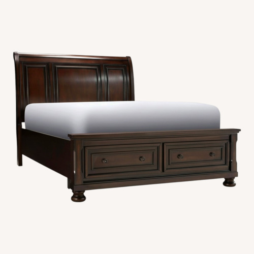 Used Raymour & Flanigan Dark Brown Wood Queen Bed for sale on AptDeco