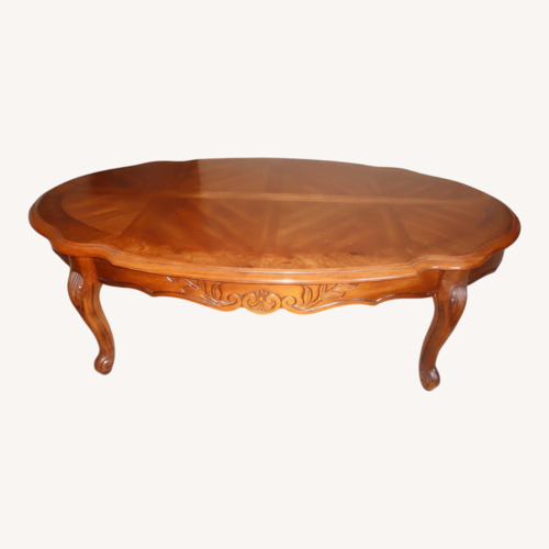 Used French Provincial Oval Coffee Table for sale on AptDeco