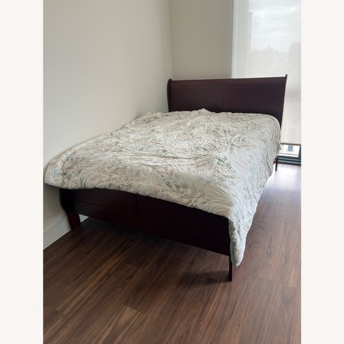 Used Dark Brown Wood Queen Bed for sale on AptDeco