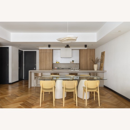 Used CB2 Natural Glass Dining Table for sale on AptDeco