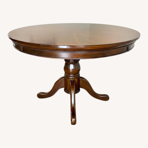 Used Dark Brown Wood Dining Table for sale on AptDeco