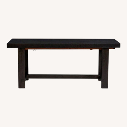 Used Pottery Barn Reed Black Wood Dining Table for sale on AptDeco