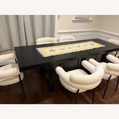 Used Pottery Barn Reed Black Wood Dining Table for sale on AptDeco