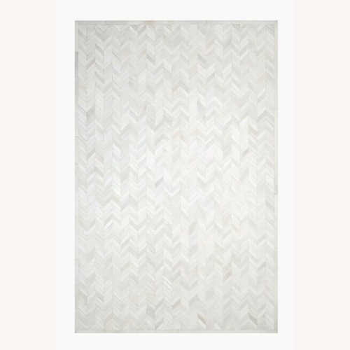 Used Cowhide Chevron Light Gray Rug 6' x 9' for sale on AptDeco