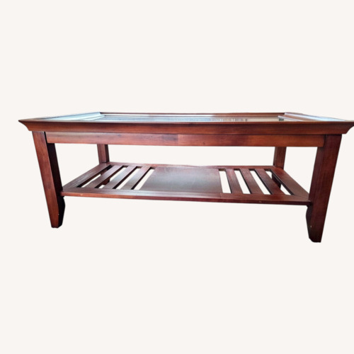 Used Living Spaces Dark Brown Wood Coffee Table for sale on AptDeco