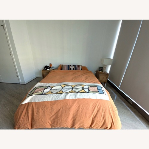 Used Pottery Barn Cayman Natural Queen Bed for sale on AptDeco