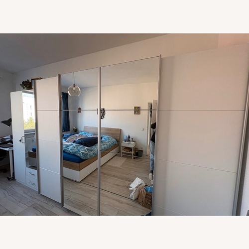 Used Wardrobe With 4 Sliding Doors and Mirrors for sale on AptDeco