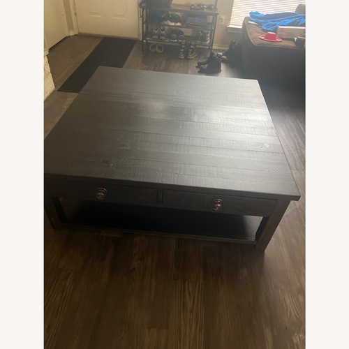 Used Black Wood Coffee Table for sale on AptDeco