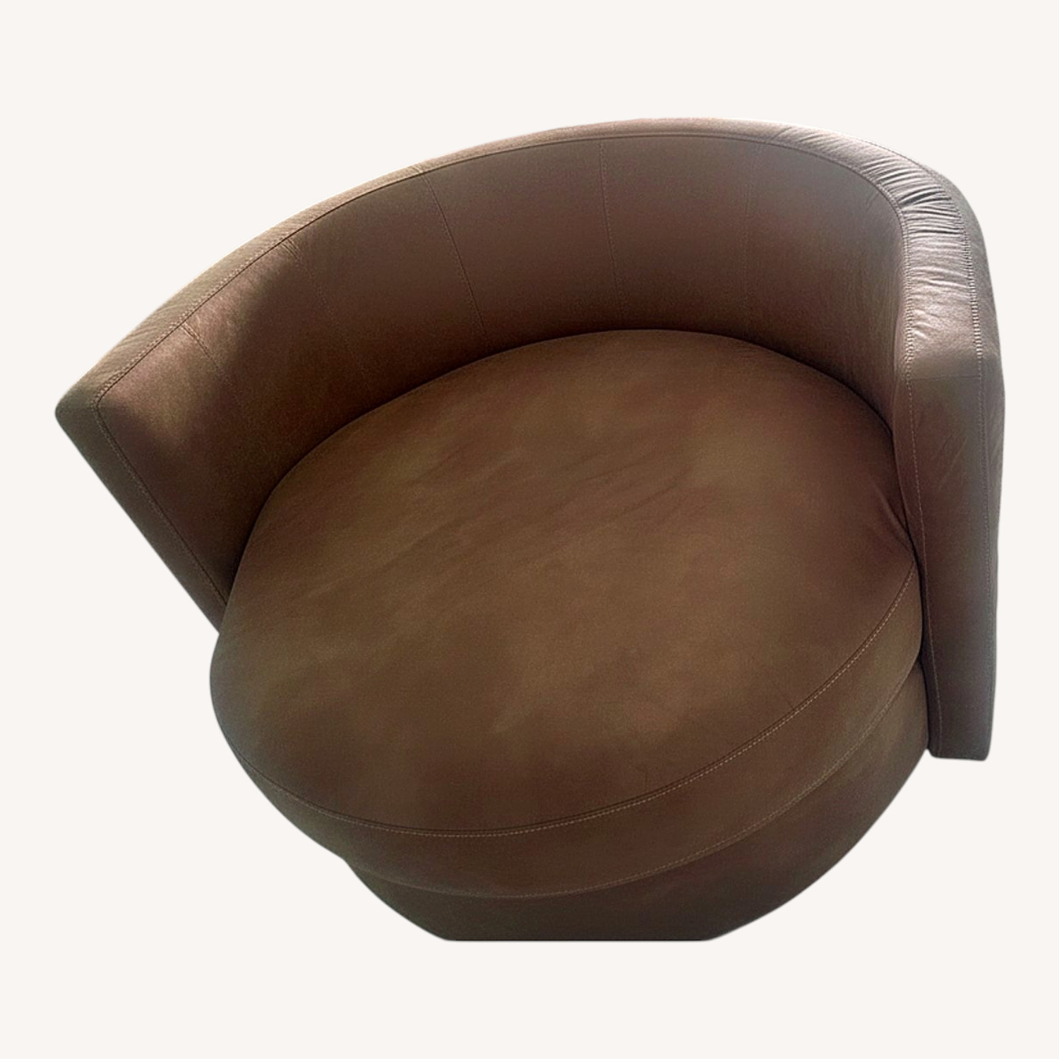 Tan Swivel Chair with Three Pillows included - image-0