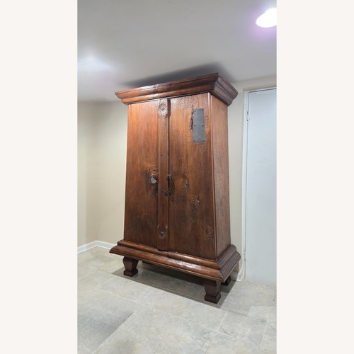 Used Dark Brown Wood Armoire for sale on AptDeco