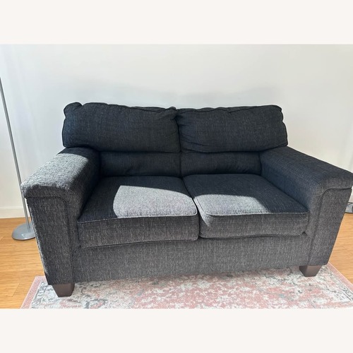 Used Onyx Black Fabric Loveseat for sale on AptDeco