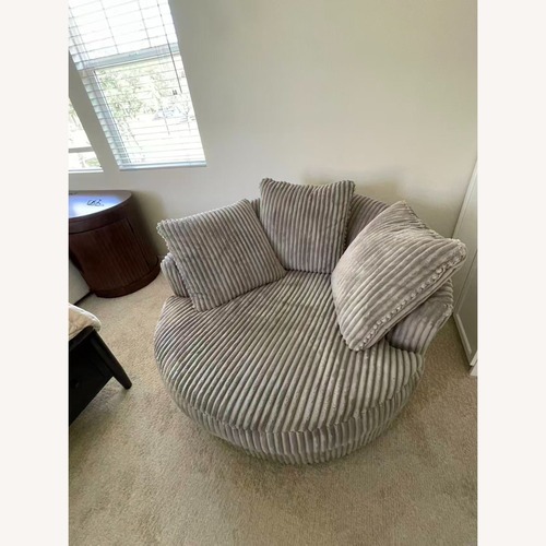 Used Ashley Lindyn Oversized Swivel Accent Chair for sale on AptDeco