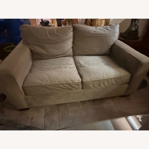 Used Pottery Barn Dark Gray Suede Loveseat for sale on AptDeco