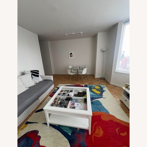 Used Beige / Red/ Blue Area Rug (Approx 7'10" x 10'10") for sale on AptDeco