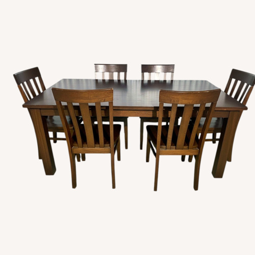 Used Pottery Barn Dark Brown Wood Dining Set for sale on AptDeco