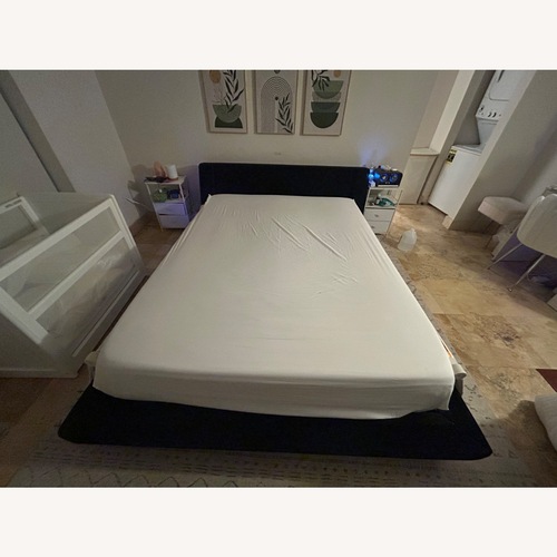 Used Rove Concepts Harper Black Wood Queen Bed for sale on AptDeco