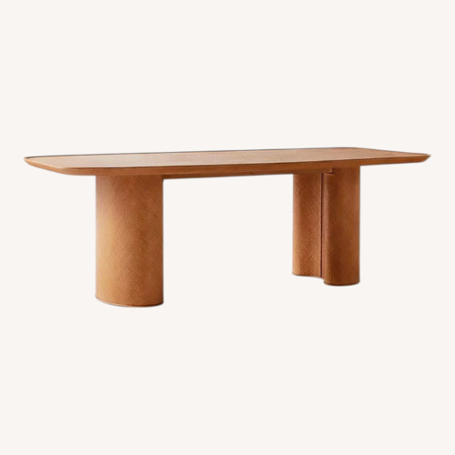 Used CB2 Crest Natural Rattan Dining Table for sale on AptDeco