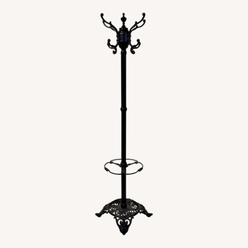 Used Vintage 1940 Black Cast Iron Coat Rack for sale on AptDeco