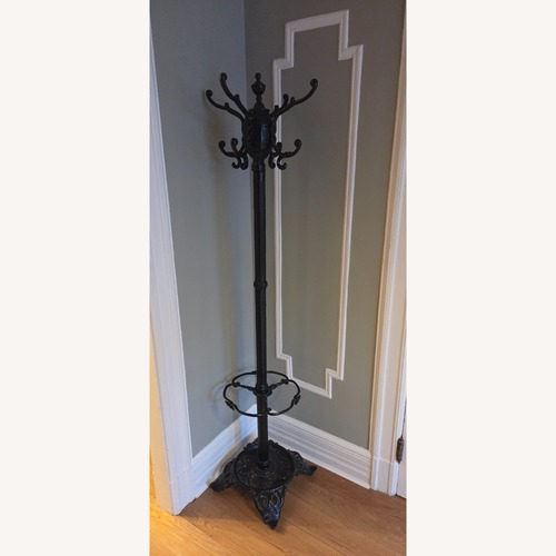 Used Vintage 1940 Black Cast Iron Coat Rack for sale on AptDeco