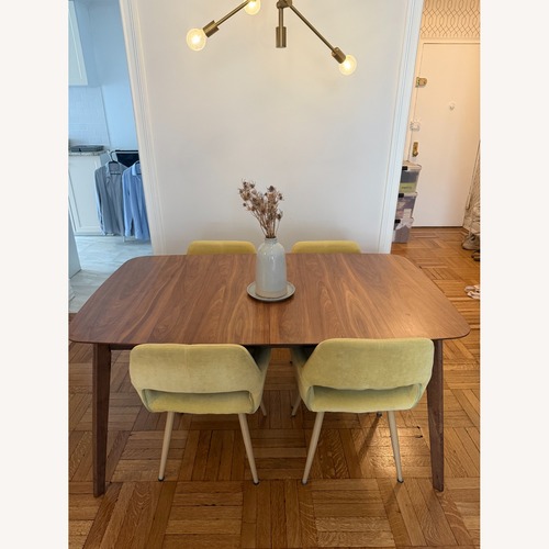 Used Dark Brown Wood Dining Table for sale on AptDeco
