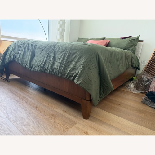 Used Raymour & Flanigan Light Gray Wood Queen Bed for sale on AptDeco