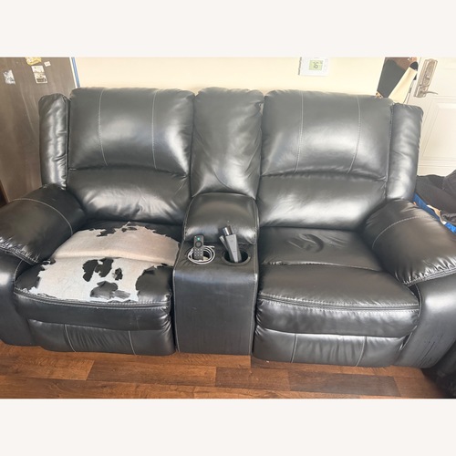 Used Signature Design Black Leather Loveseat for sale on AptDeco