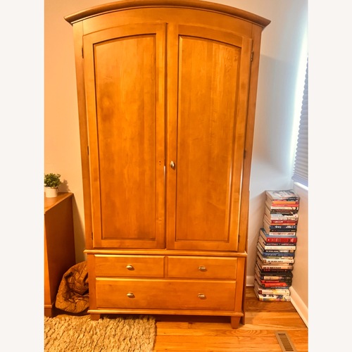 Used Ethan Allen Light Brown Wood Armoire for sale on AptDeco