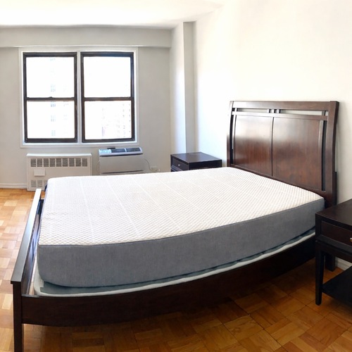 Used Raymour & Flanigan Dark Brown Wood Queen Bed for sale on AptDeco