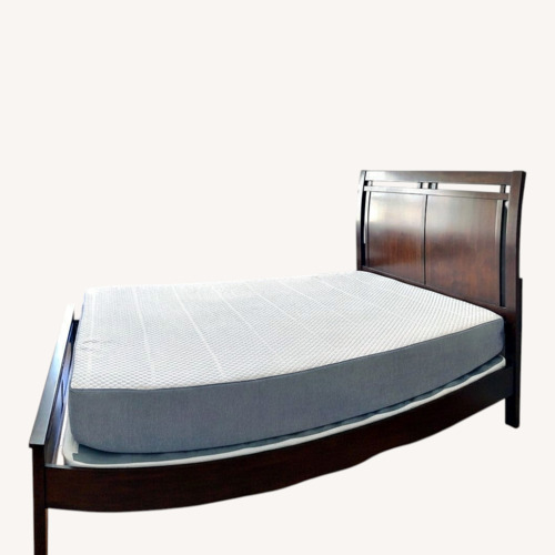 Used Raymour & Flanigan Dark Brown Wood Queen Bed for sale on AptDeco