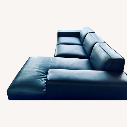 Used Black Leather 2 Piece Sectional for sale on AptDeco