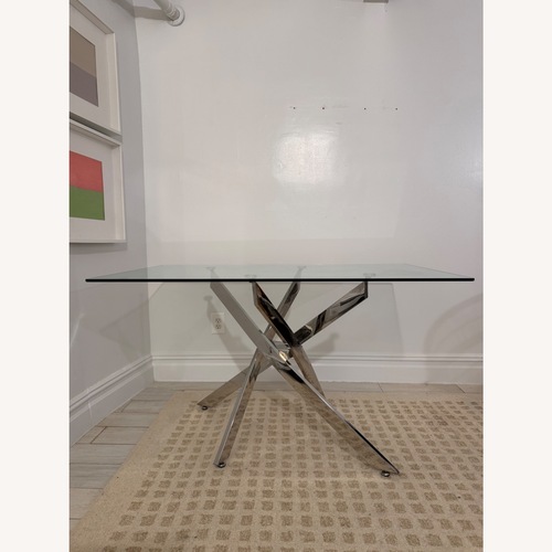 Used Wayfair Glass Dining Table with Chrome Sculptural Base for sale on AptDeco