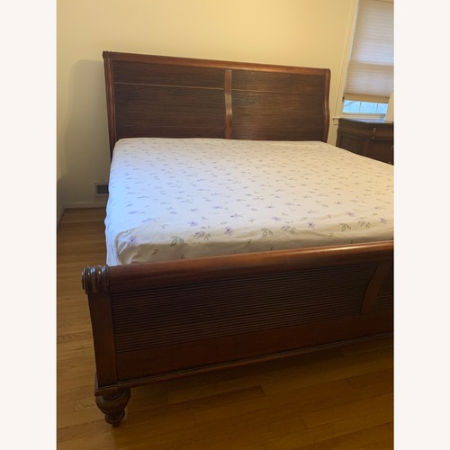 Used Solid Wood King Bed for sale on AptDeco
