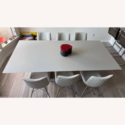 Used Light Gray Glass Dining Table for sale on AptDeco