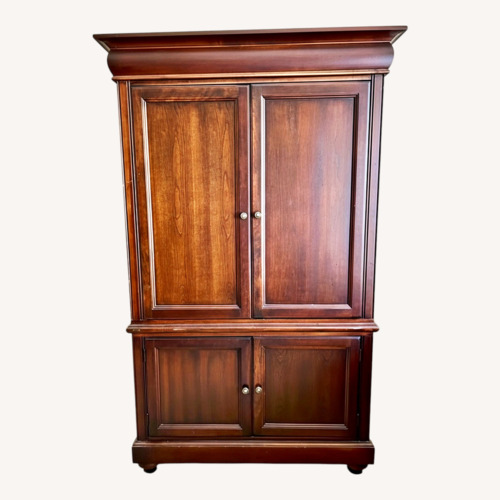 Used Dark Brown Wood Armoire for sale on AptDeco