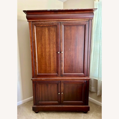 Used Dark Brown Wood Armoire for sale on AptDeco