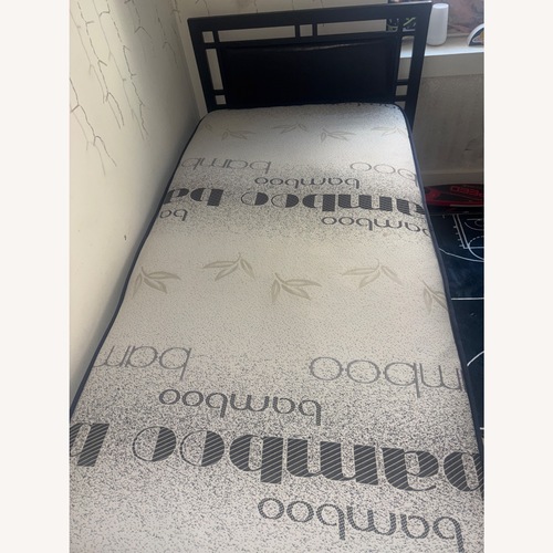 Used Totally Bamboo Black Leather Twin Bed for sale on AptDeco