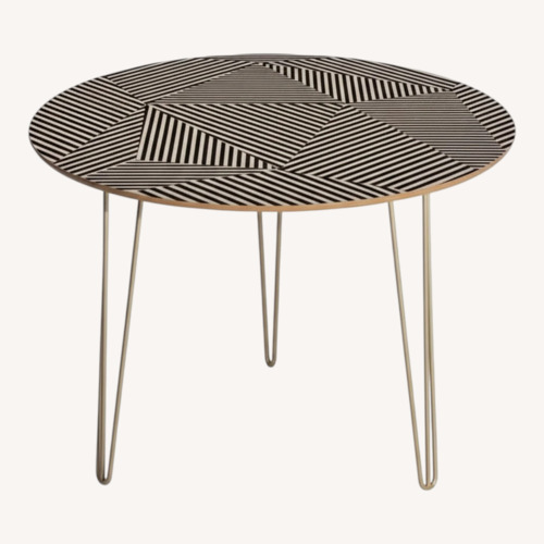 Used Chaderick Round Metal Base Dining Table for sale on AptDeco