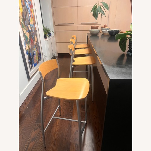 Used Natural Wood and Stainless Steel Counter Stools for sale on AptDeco