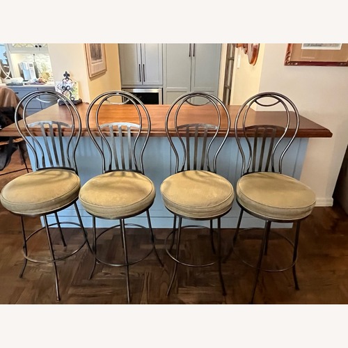 Used Wrought Iron Swivel Bar Stools with Cushion Seats for sale on AptDeco