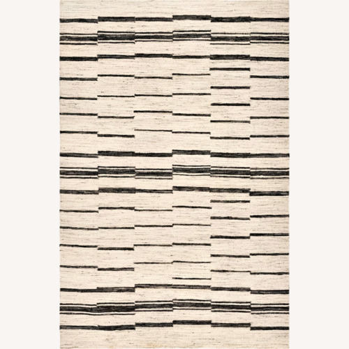 Used Surya Light Gray Area Rug 8' x 10' for sale on AptDeco