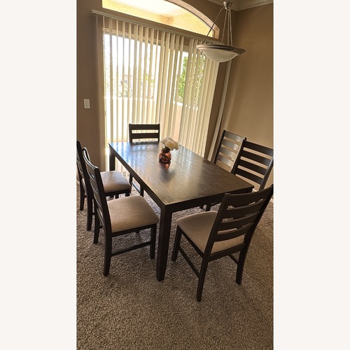 Used Ashley Furniture Wooden Dining Table and Chairs  for sale on AptDeco