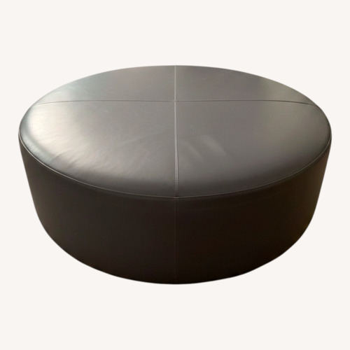 Used Round Leather Ottoman  for sale on AptDeco