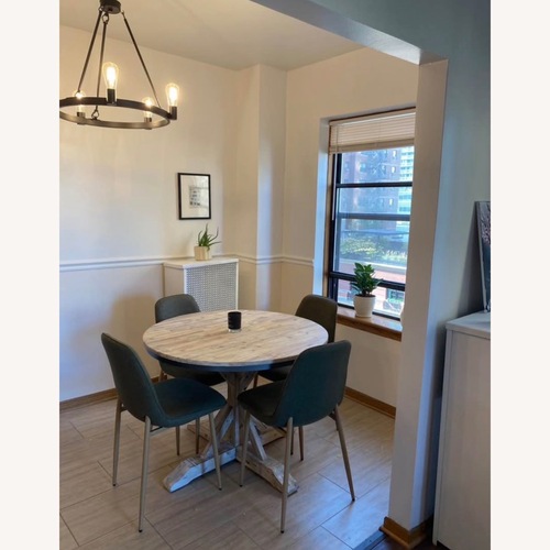 Used Eugley Acacia Round Dining Table for sale on AptDeco