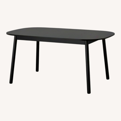 Used IKEA Vedbo Black Wood Dining Table for sale on AptDeco