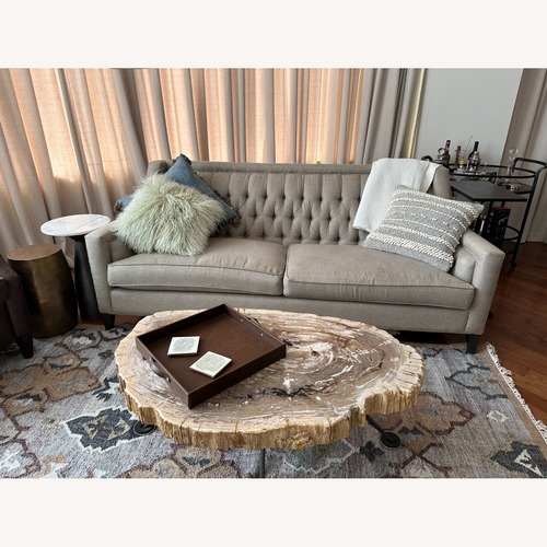 Used Arhaus Terra Petrified Wood Coffee Table for sale on AptDeco