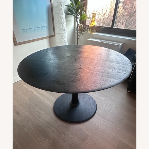 Used ETHNICRAFT Black Round Dining Table for sale on AptDeco